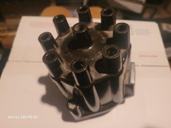 1967 no R distributor cap. Rare early design, note no embossed r