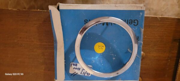 1956 57 corvette nos front emblem bezel.