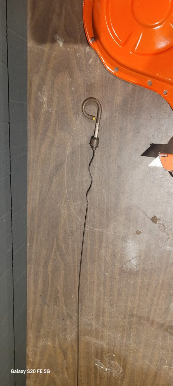 Early chevrolet nos yellow dipstick.   150.00. W  Gm sticker