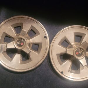 1965 driver corvette hubcaps   one year only.  Good for driver havent been cleaned in 30 years.  195.00 for the pair.
