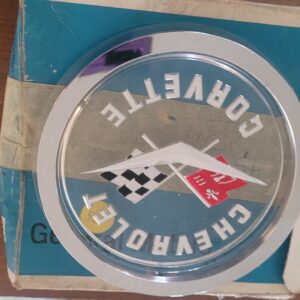 1957 corvette nos emblem and bezel as shown may fit others. Mint gm old part 283. 