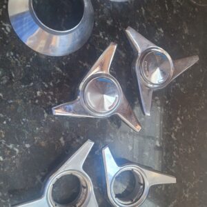 4 ko spinners. 2 gm originals 2 w pin provision and 2 center trim. I have another ad w 2 gmm and 2 w pins