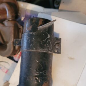 293 coil w bracket.  Original. Has 2 dings as shown.