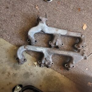 z28 1969 exhaust manifolds.   Pitted and some pits filled with high hrat putty..