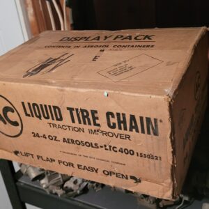 A display box of 24 cans of gm nos liquid tire chain dispenser. 599.00 all.....camaro nova chevelle impala .