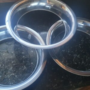 Nice corvette  4 clip originals 1969 up  15 x 8 gm trim rings w part stickers still attached. 