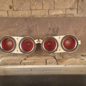 A set of real nice 70 z28 lt1 camaro taillights and housings.  Excellent lenses and metal trim.