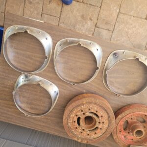 1970 chevelle malibu ss headlight bezels ...set of 4. They fit perfect not like repro.  Used 56 year old parts nice for driver or plate for show. 