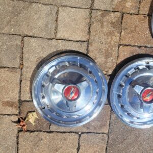 Pair of 2 optional with spinners 1957 chevy belair hub caps. Nice drive. 